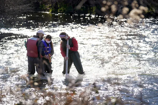 Fresno State students collecting research samples in the San Joaquin River