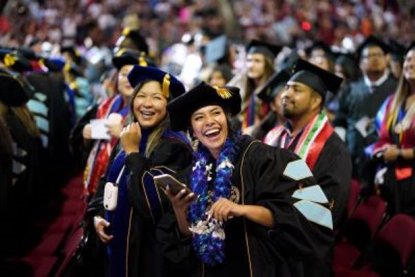 smiling students at graduation