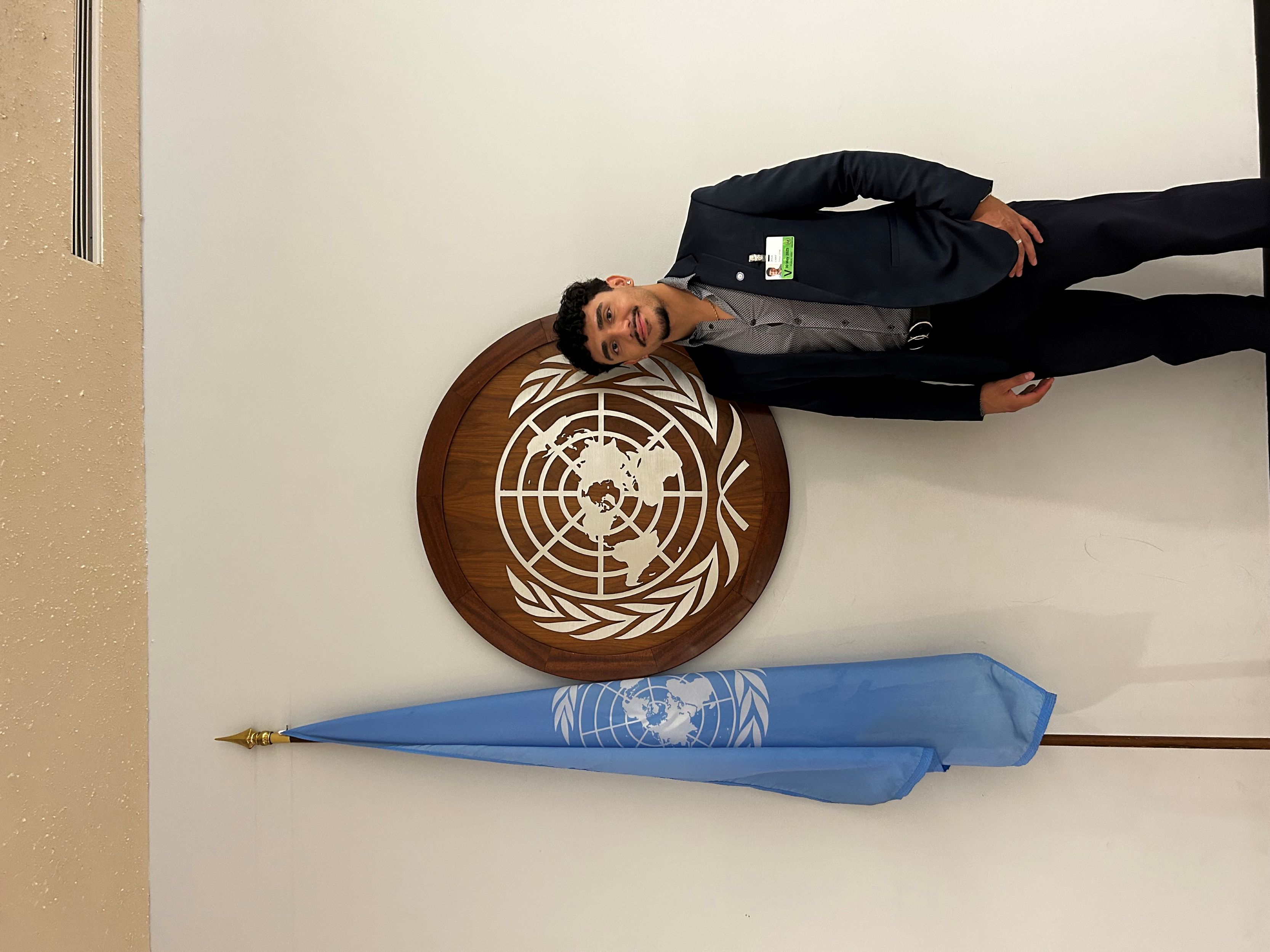 man standing in front of plaque